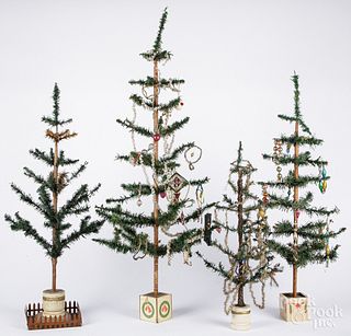 Four German feather trees, with various ornaments