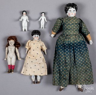 Five bisque head dolls