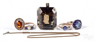 Four low grade gold and gemstone rings