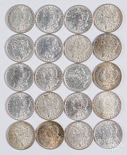 Twenty Morgan silver dollars, some uncirculated.