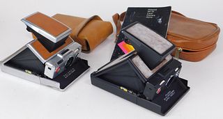 Two Polaroid SX-70 Cameras