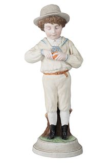 A LARGE RUSSIAN PORCELAIN FIGURE OF A YOUNG BOY PEELING AN ORANGE, GARDNER PORCELAIN FACTORY, MOSCOW, LATE 19TH CENTURY