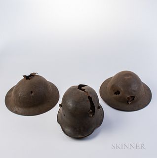 Three Battle-damaged WWI Helmets