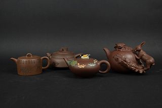 Group of Four Yixing Teapots.