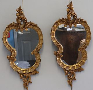 Pair Of Antique Carved And Giltwood Mirrors .