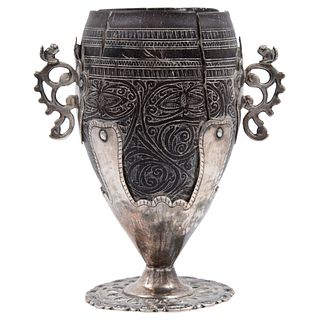 SILVER-MOUNTED CHOCOLATE CUP. MEXICO, 18th Century. Sgraffito coconut skin with silver applications.