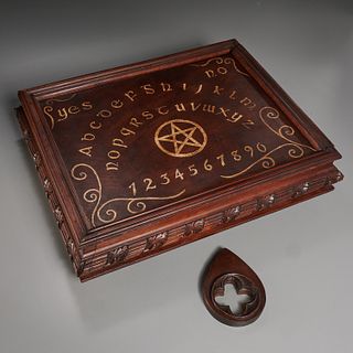 Ornately carved Ouija board in Victorian case