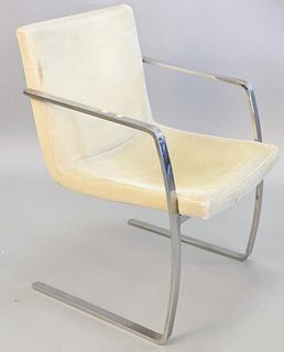 Contemporary armchair, continuous metal arms terminating to legs, green upholstery, possibly Knoll, ht. 33", wd. 22 1/2", dp. 18".