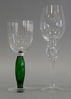 Two sets of stem wine glasses, twelve tall clear glass with bubble in stem, similar to Steuben, along with a set of eleven stem glasses with green ste