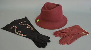 Three piece lot, to include: Hermès red rabbit felt hat, size 55; along with two pairs of gloves, one pair black suede with embroidered flowers and on