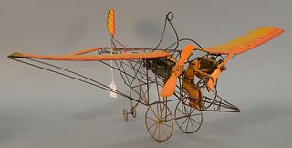 Model airplane, wire frame, orange cardboard wings, wooden pilot figurine, "Earl 78" on rudder, light wear and minor damages, ht. 12 1/2", wd. 22" x d