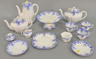 Two tray lot: Shelley "Dainty Blue" partial tea set, thirteen pieces, English, includes: two tea pots, one coffee pot, four cups, two saucers, one sna