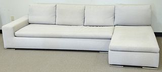 Minotti two-part sectional sofa, cream upholstery, on chrome feet, 112" l.