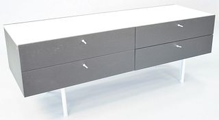 Cassina sideboard by Piero Lissoni, black with white marble top, four drawers, on chrome legs, 25 1/2" h., top 71" x 24".