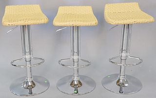 Three 20th C. woven rattan and chrome bar stools, 30" h. Provenance: The Estate of Andrew Wolf, New Haven, CT, Arts Chief.