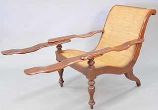 Plantation arm chair with swing arms and woven seat, 34" h. x 27" w.