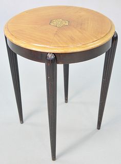In the style of Paul Follot, round table, having inlaid top with flower and tree, 24" h. x 19" diameter.