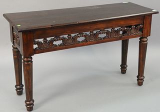 Wood sofa table with pierced foliate carvings to skirt, on turned and tapered legs, 28" h. x 48" w. x 17 1/2" d. [Provenance: Former home of Mel Gibso