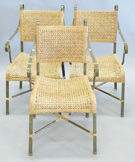 Set of three woven seat and back armchairs with green metal frame, scrolled arms and back, "X" shaped stretcher base, ht. 34 1/2", wd. 18 1/2", dp. (s