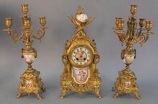 French gilt and enameled mantle clock with two matching candelabra, painted figures/landscapes to enamel, some cracks to enamel on one candelabra, clo