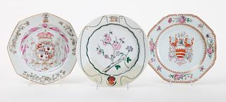 TWO CHINESE EXPORT FAMILLE ROSE ARMORIAL PORCELAIN OCTAGONAL PLATES AND A CIRCULAR PLATE