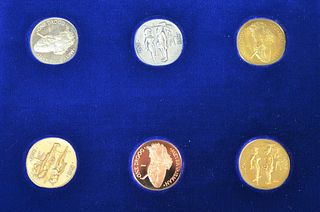 Set of six Meyer Vaisman (b.1960) coins in wood box, box: 10 11/16" x 13 5/16" x 2" [PROVENANCE: Phillips de Pury & Company, N.Y.]