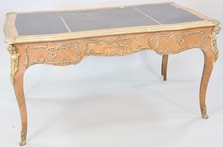 Louis XV style ormolu-mounted bureau plat having a rounded rectangular top with inset black leather writing surface with gold embossed trim, three sha