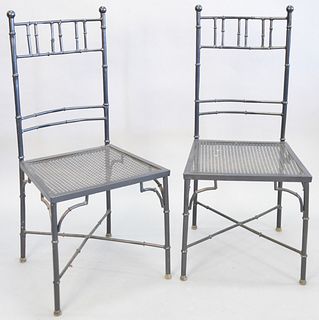 Black faux bamboo chairs, 12 powder coated metal, "X" cross stretchers, 38 1/4" h. x 16" d. (seat). Provenance: Former home of Mel Gibson, Old Mill Rd
