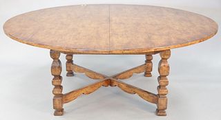 Round dining table with "X" stretcher base, 29" h. x 74" diameter, leaf: 20" w.