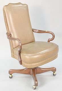 Leather upholstered swivel executive chair, 42 1/2" h. x 26 1/2" w., Provenance: Former home of Mel Gibson, Old Mill Rd, Greenwich, CT.