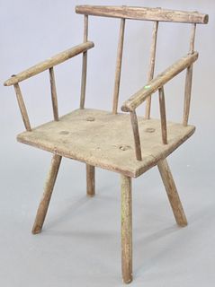 Primitive plank seat arm chair, English or French, 18th C., seat height 16", 31" h., Provenance: Former home of Mel Gibson, Old Mill Rd, Greenwich, CT