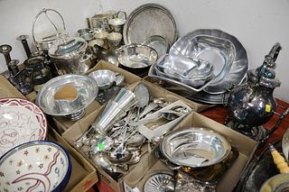 Large group of silver plate and pewter to include tilting pot, candlesticks, serving pieces, cups, etc.