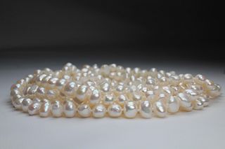 Unusual 100 inch Strand of White Freshwater Pearls