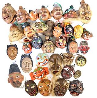 Large Collection of Asian Heads and Masks