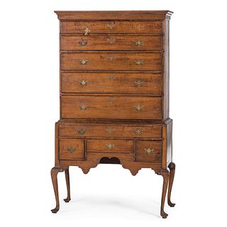 A New England Queen Anne Carved and Figured Maple Flat-Top High Chest