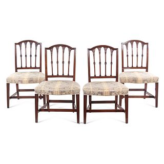 A Set of Four Federal Carved Mahogany Dining Chairs