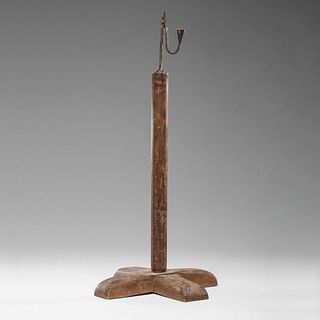 A New England Wrought Iron Rush Light on Wooden Stand