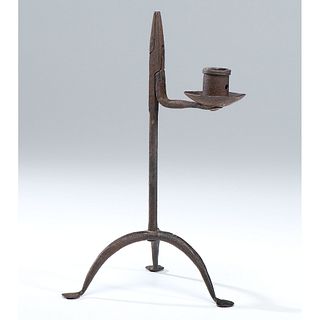 A Wrought Iron Rush Light Candle Holder