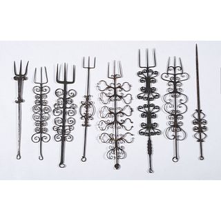 Fourteen Wrought Iron Butcher's Forks and Hooks