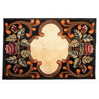 A Rose and Cartouche Decorated Hooked Rug