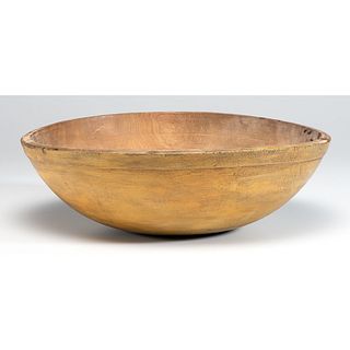 A Large Treenware Bowl with Mustard Paint