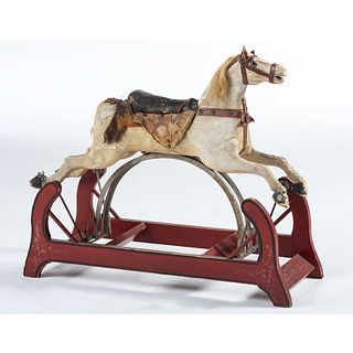 A Carved, Polychrome Painted and Stencil-Decorated Rocking Horse