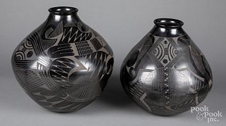 Contemporary black on black pottery vessels