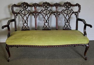 Finely Carved and Upholstered Mahogany Loveseat.