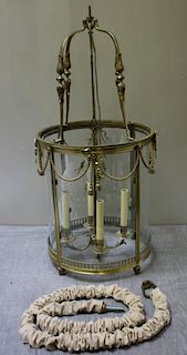 Gilt Metal and Curved Glass Hurricane Chandelier.