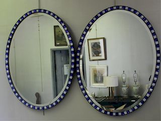 Pair of Oval Beveled Decorative Mirrors.