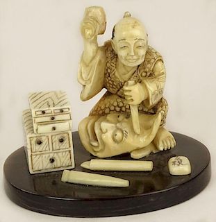 Miniature Hand Carved Ivory Antique Japanese Figurine. "The Mask Maker"