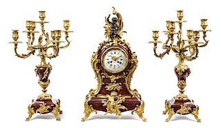 A Louis XV Style Gilt Bronze Mounted Marble Clock Garniture Height of clock 24 1/2 inches.