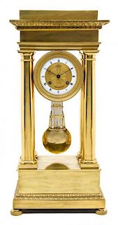 * A French Gilt Metal Portico Clock Height 21 x width 10 x depth 6 inches.