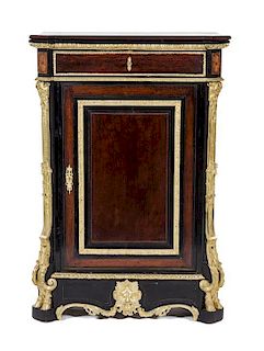* A Napoleon III Gilt Bronze Mounted and Parcel Ebonized Meuble d'Appui Height 51 1/2 x width 35 1/2 x depth 18 inches.